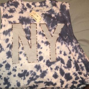 Shirt that says Ny on it. Never been worn.